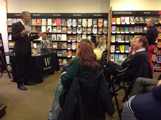 Alexandre G. Mitchell speaking to an audience at Waterstones in Brussels